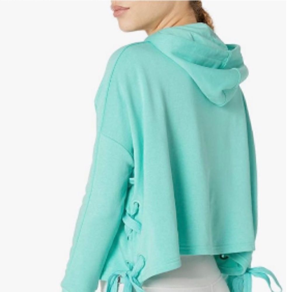 PUMA Heart T7 Track Jacket size XS, color called Aruba Blue, more of a turquoise